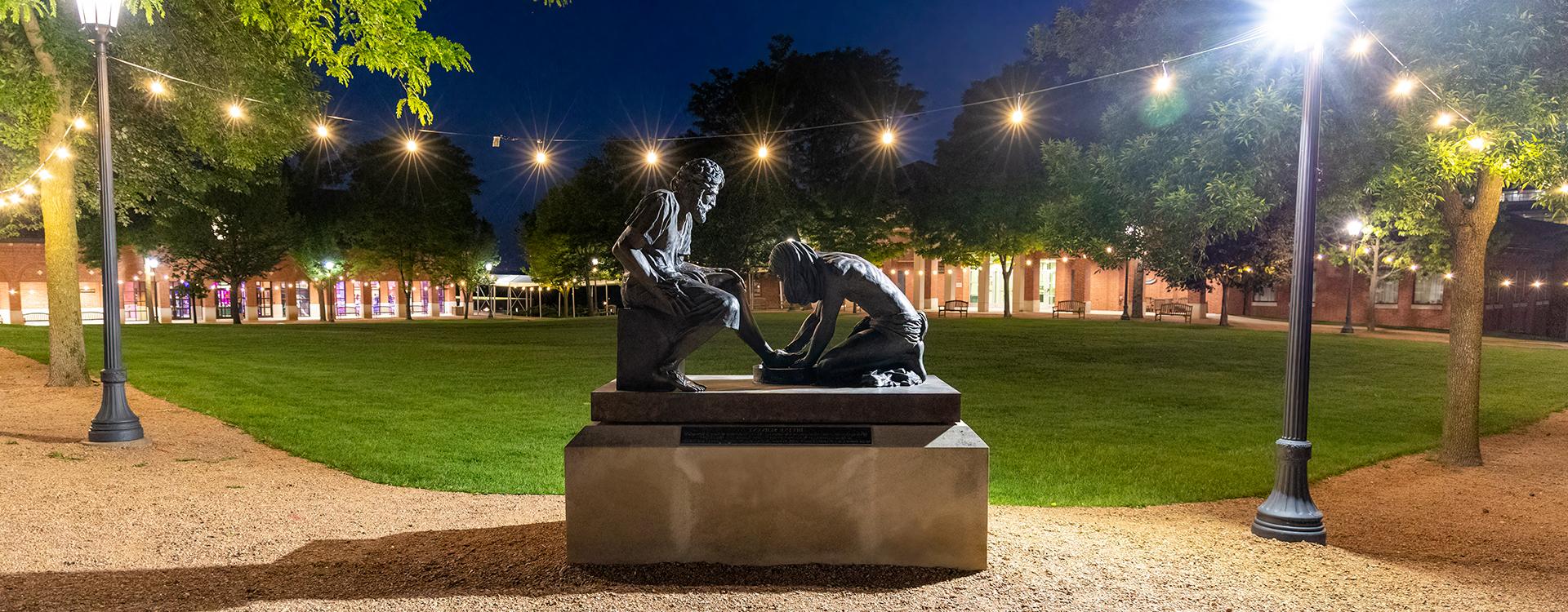 Divine Servant Statue at night